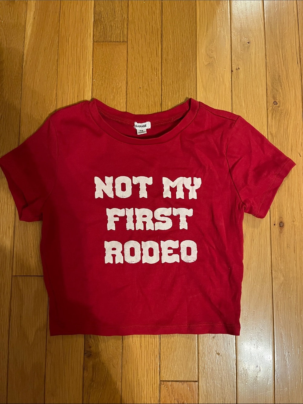 Garage “Not my first rodeo” red baby tee